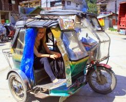 A girl in a tricycle