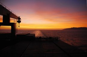 Cargo Ship Sunset View