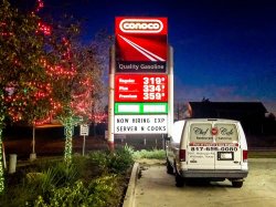 Conoco gas station sign with Chef Point Cafe van