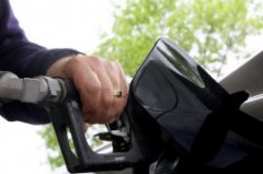 John Cavalier of Loudonville pumps gas at a station on Route 9 on Wednesday, May 20, 2015, in Colonie, N.Y. (Olivia Nadel/Special to the Times Union) Photo: ON