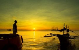 Photo of a boat at sunrise in the Philippines