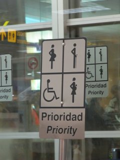 Priority parking sign depicting pregnant, elderly, or handicapped individuals