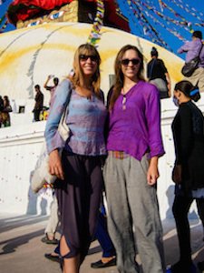 solo female travelers in front of tents