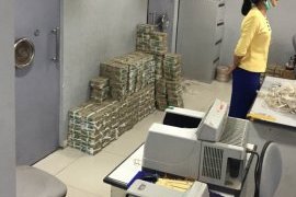 Stacks of cash at a local bank